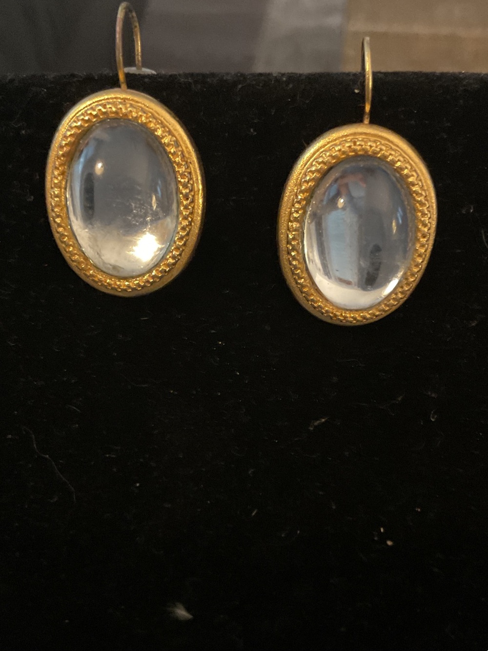 Mauve Carr Gold-Trim Clear Oval Drop Earrings, pierced.